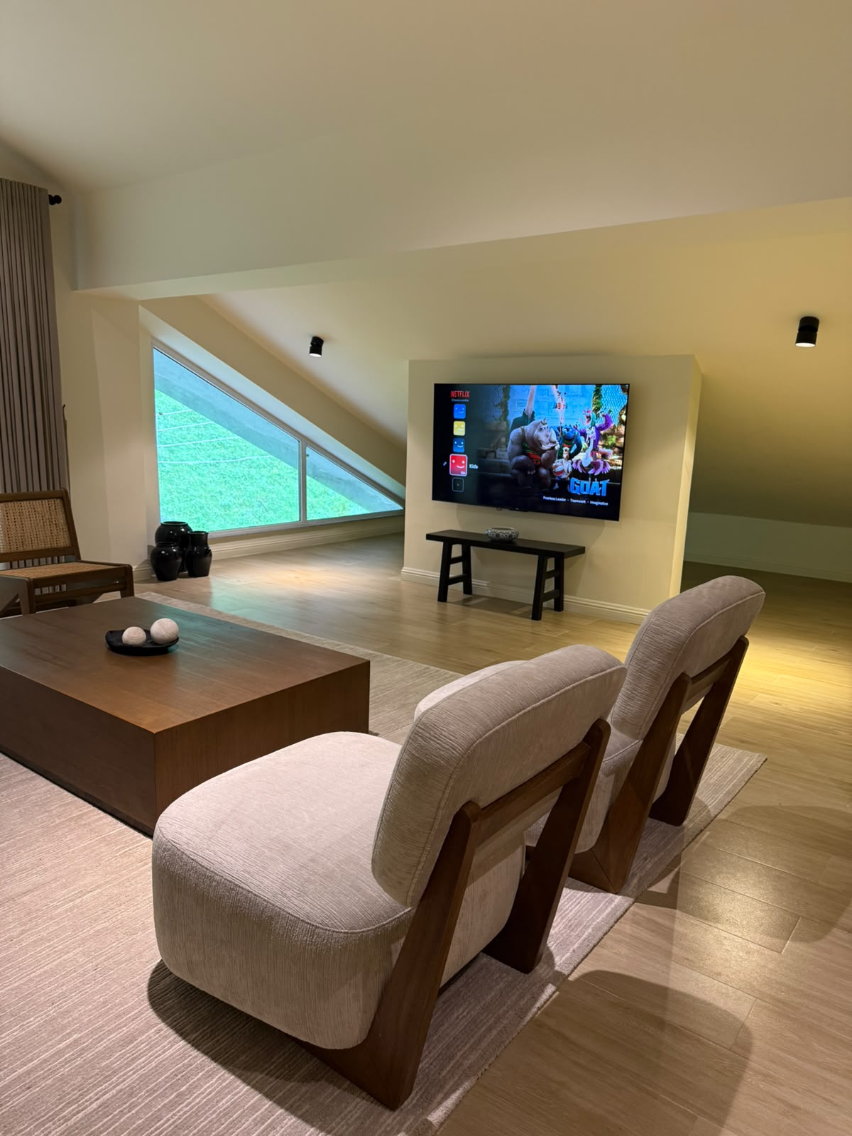 Attic TV den with smart TV and forest window at MYG Nathiagali